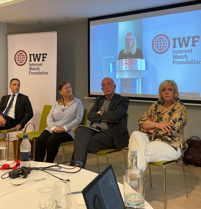 From left, speakers at the IWF’s 25th anniversary event in Brussels included Prof Hany Farid from the University of California, Berkeley; Maria Castello-Branco, Vice-Chair of the Lanzarote Committee; IWF Chair Andrew Puddephatt OBE; and Hilde Vautmans MEP, Vice-Chair of the European Parliament Intergroup on Children’s Rights. Cathrin Bauer-Bulst, head of unit for the fight against cybercrime and child sexual abuse in DG Migration and Home Affairs shown on screen
